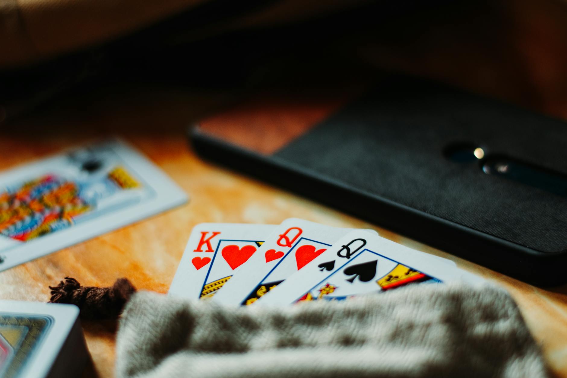 Grading, Authentication, and the Risk of Counterfeits in Card vs. Art Markets